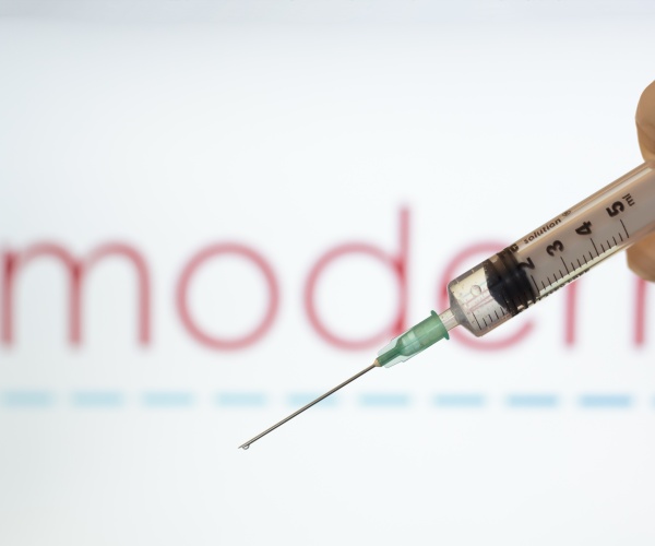 Moderna logo and syringe