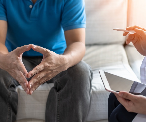 doctor talking to man about prostate cancer in his office
