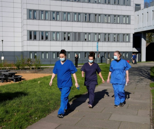 Healthcare workers in UK in masks outside hospital