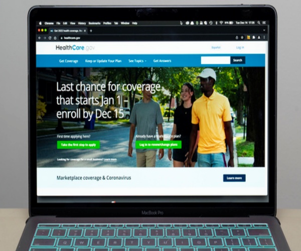 laptop open to a screen explaining open enrollment