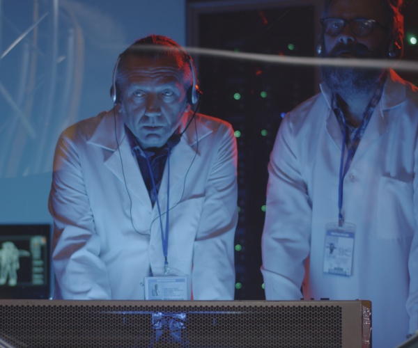 scientists in lab with headphones on