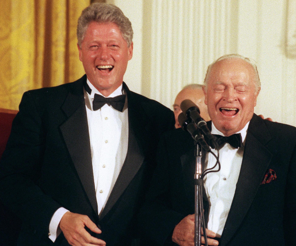 bill clinton and bob hope laugh durig a white house ceremony