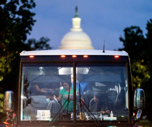 migrants arrive by bus in washington, d.c., from texas