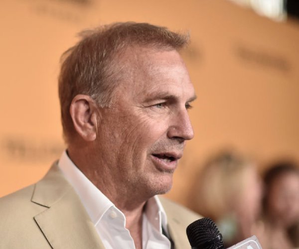 kevin costner attends a premiere