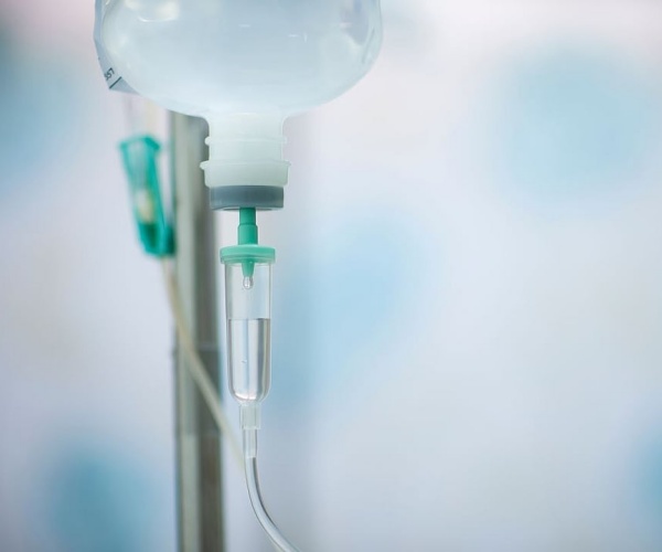 a bag of intravenous medication on pole