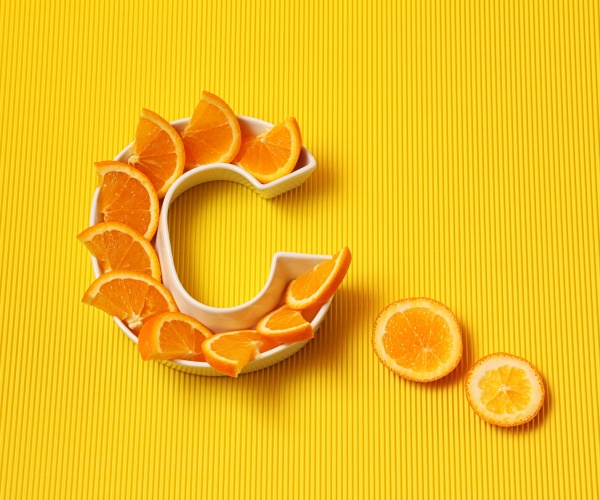 orange slices laid out in the shape of the letter 'C'