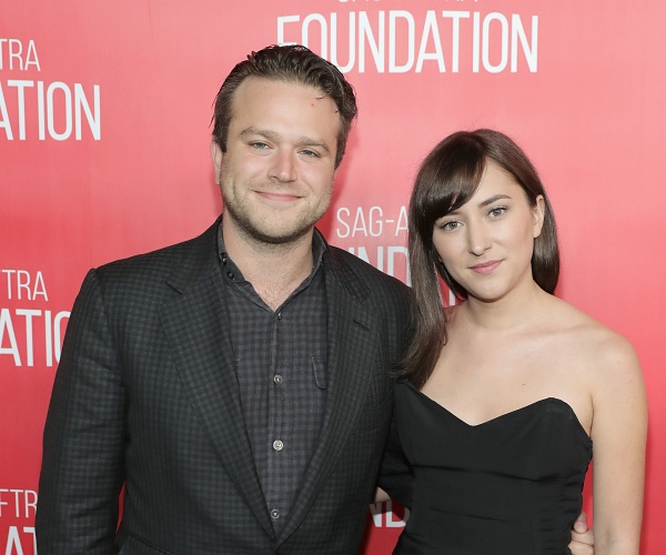 zak and zelda williams stand on red carpet