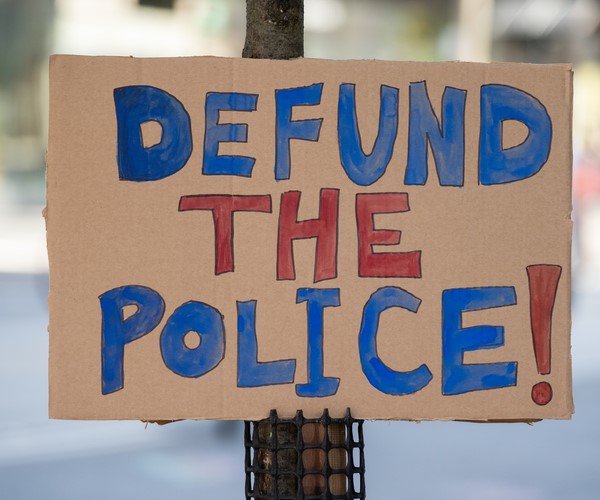 defund the police sign