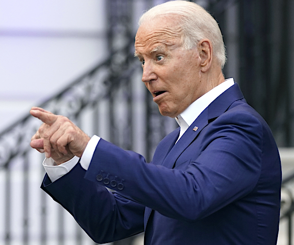 president joe biden points with a goofy face in mocking the media asking him a question