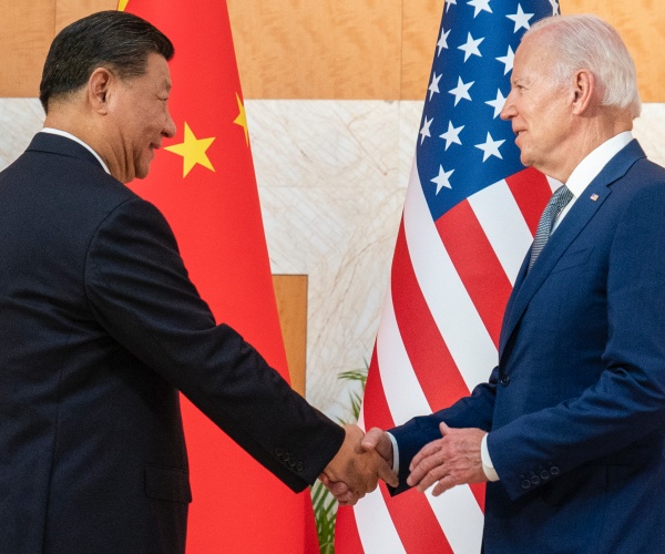 president joe biden shakes hands with chinese president xi jinping