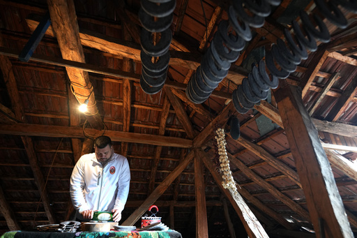 A Traditional Sausage in the Shape of a Horseshoe Is 'ironed' for Dryness in Southeastern Serbia