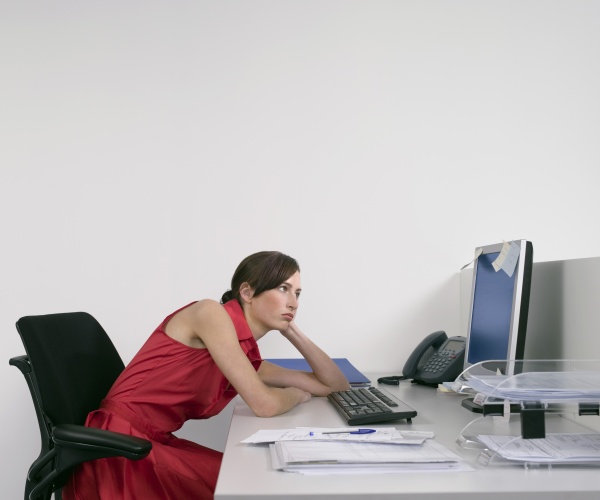 woman slouching at desk