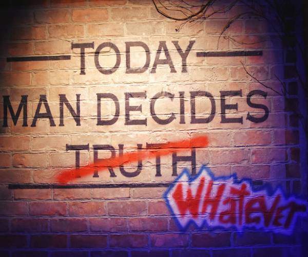 a brick wall with the words today man decides truth written on it the word truth has been replaced with whatever