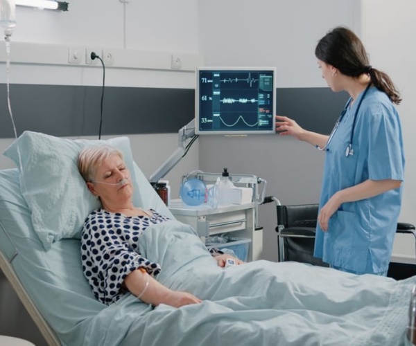 woman in hospital with an IV