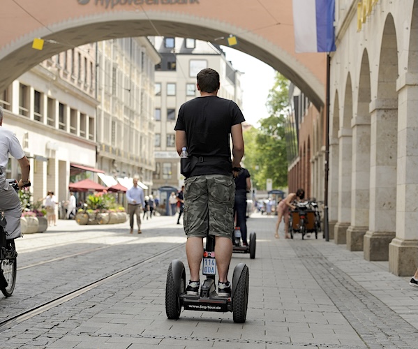 man riding a segway scooter