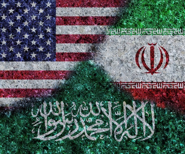 us, iran and saudi arabia flags painted on grunge texture wall