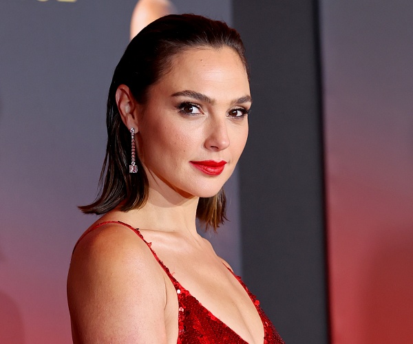 gal gadot stands on red carpet