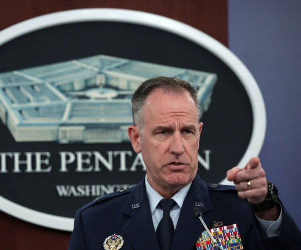 Patrick Ryder points his finger at a press conference at the pentagon