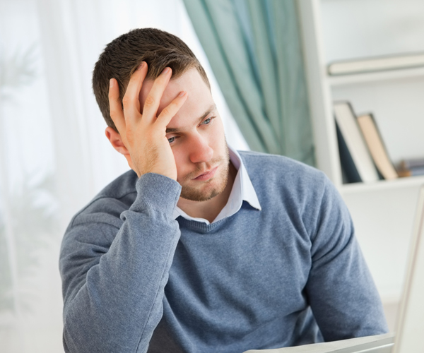 a man showing signs of fatigue while working