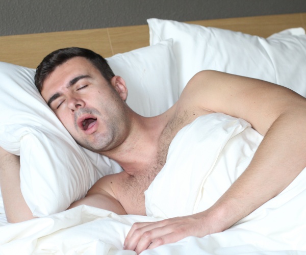 man sleeping with mouth open