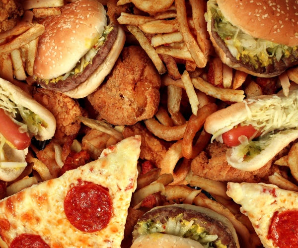 a variety of fast food including hamburgers, pizza, french fries