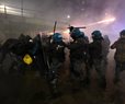 Italian Police Fire Tear Gas as Protesters Clash Near Winter Olympics Hockey Venue
