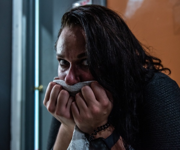 woman looking at camera, sweating