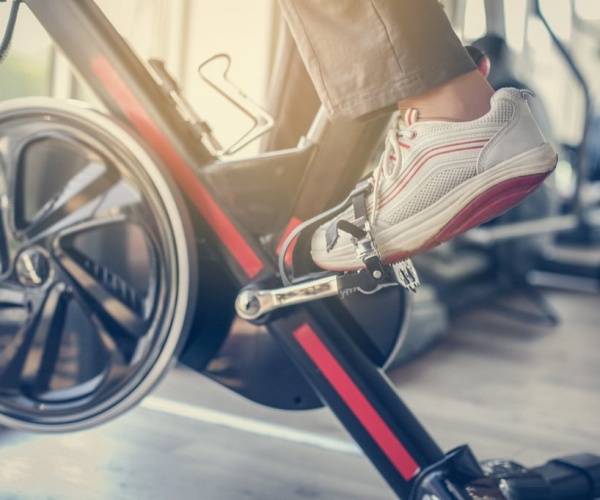 close up of person's foot on a spin bike