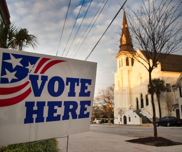 a vote here sign outside a church