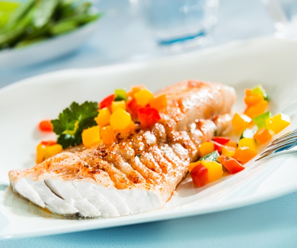 fish on plate with vegetables