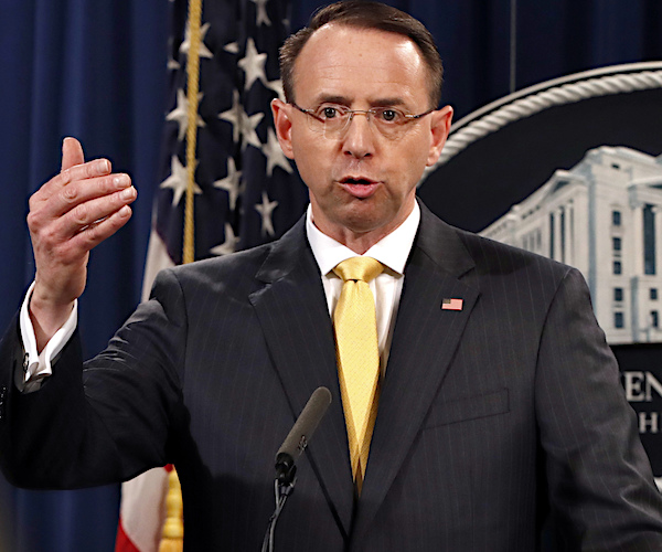 deputy attorney general rod rosenstein gestures with his right hand while delivering remarks from the white house