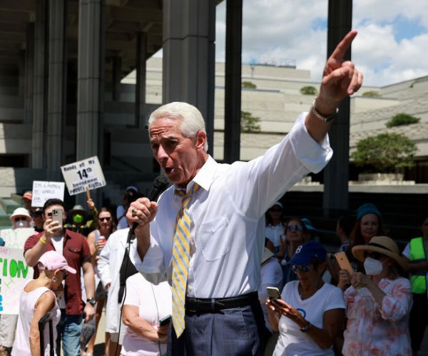 rep. charlie crist speaking at a rally