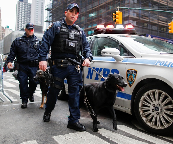 two police officers with a police dog