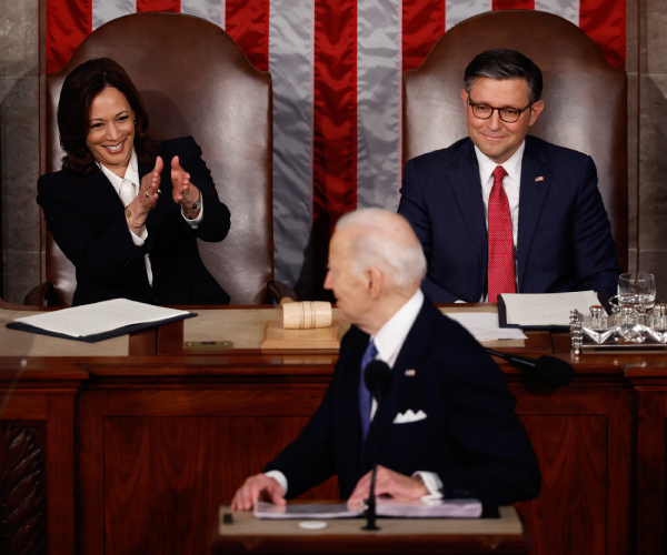 biden at the state of the union turning to kamala harris who is clapping with speaker mike johnson seated beside her