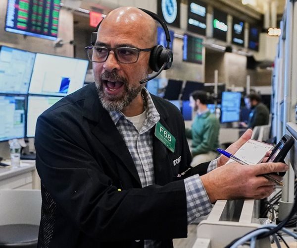 Dow Jumps 600 Points to Close at New Record