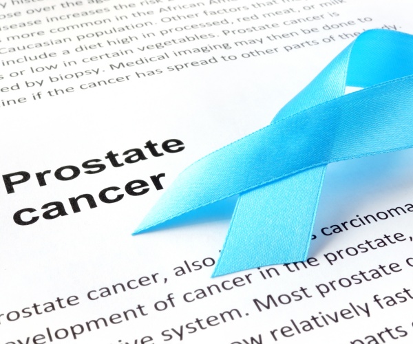 paper with prostate cancer and light blue ribbon