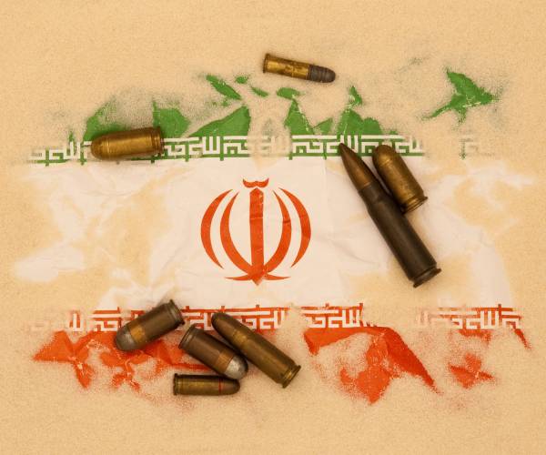 an iranian flag with bullets on top