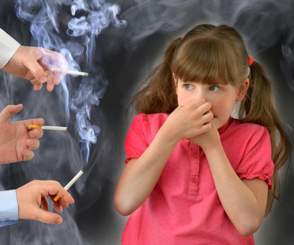 young girl with hands holding nose, mouth to stay away from adult smokers, smoke