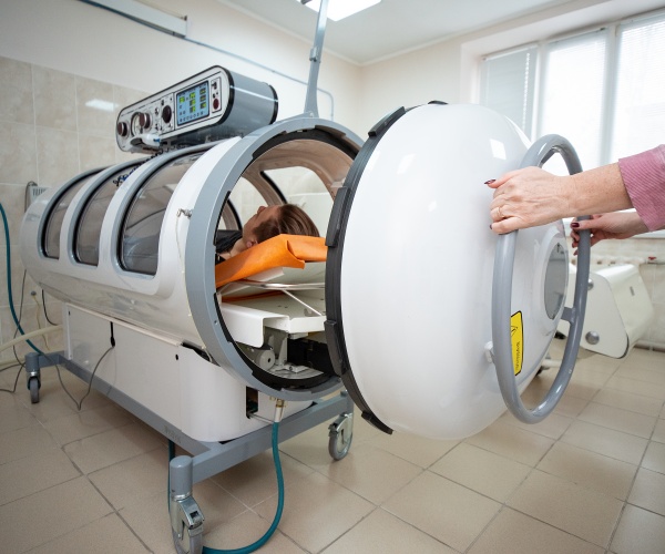 person in a hyperbaric oxygen chamber