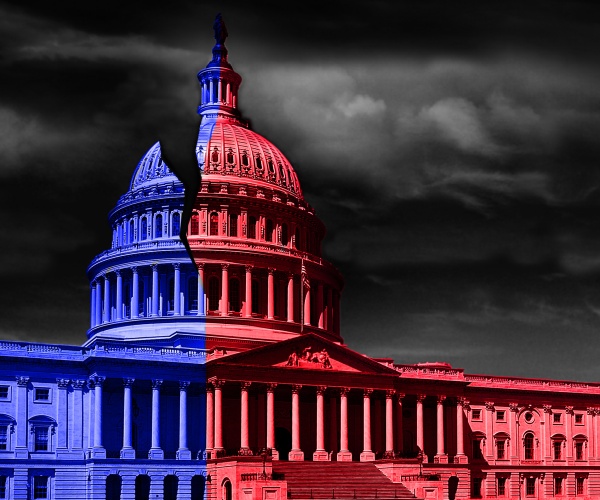 united states capitol building half red and blue representing democrat and republican political division