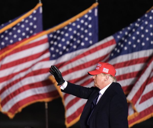 former president donald trump waving