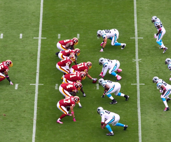 NFL football game, players lined up for a play