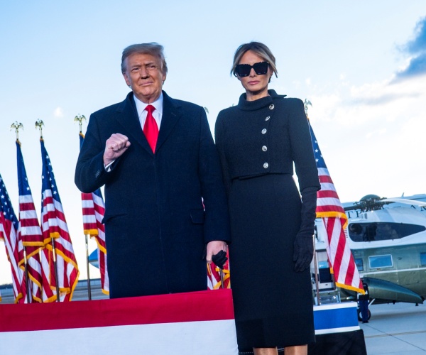 donald and melania trump wave to supporters