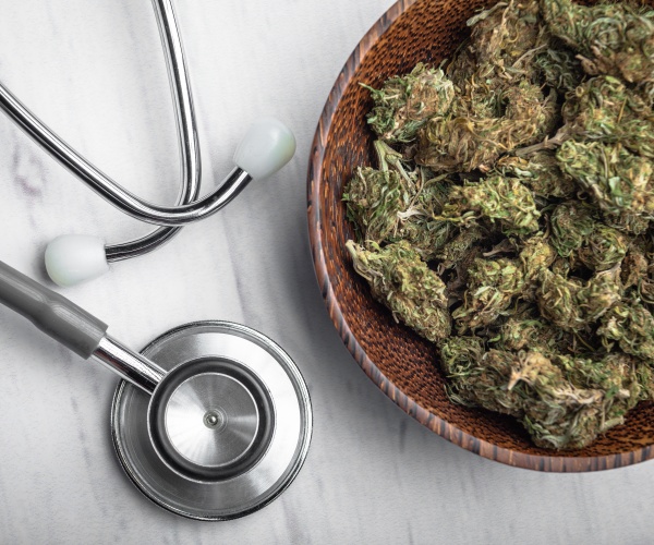 marijuana in a bowl, with a stethoscope next to it