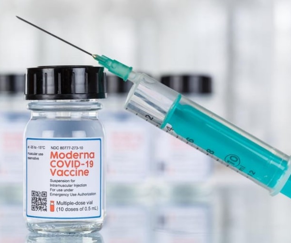 Vial of Moderna COVID vaccine and syringe