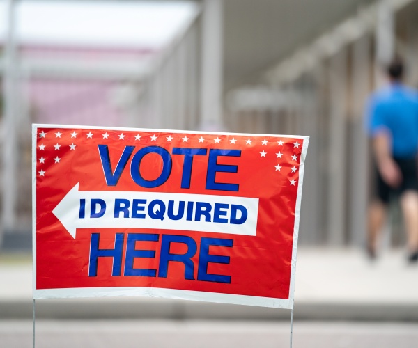 a sign directs voters to a polling station