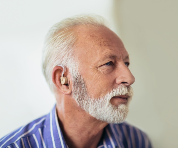 older man wearing a hearing aid