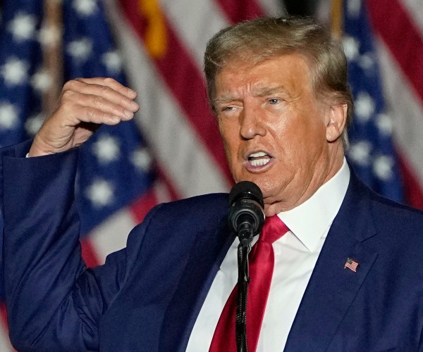 donald trump gestures while speaking