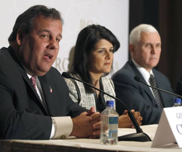 christie haley and pence seated at a table