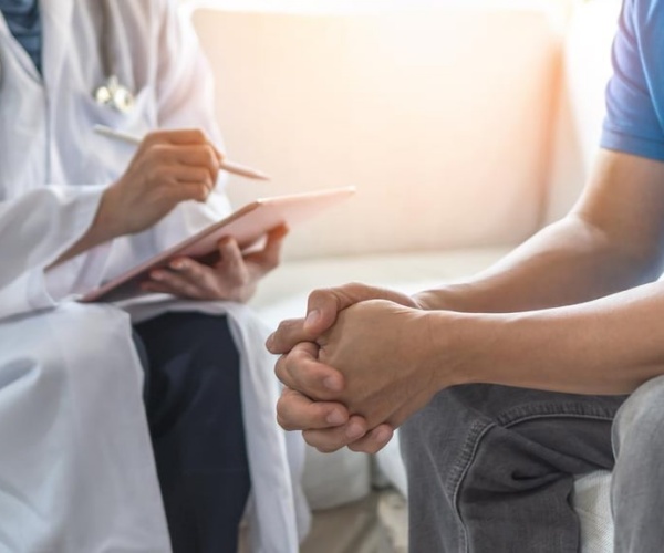 Doctor discussing health information with patient